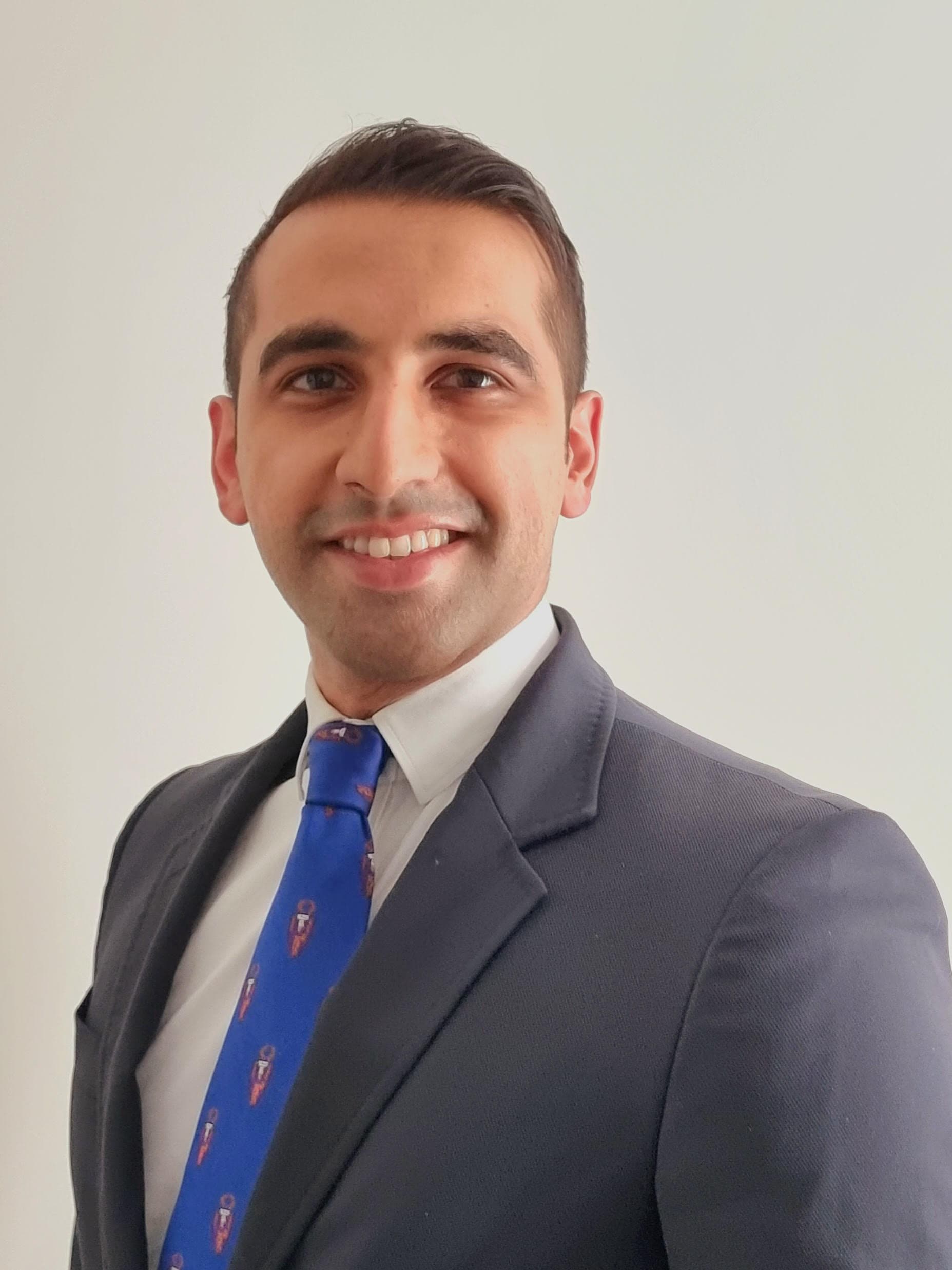 Dr. Farhan Shahid at Carter & George Clinic in Windsor, pictured in a professional setting.