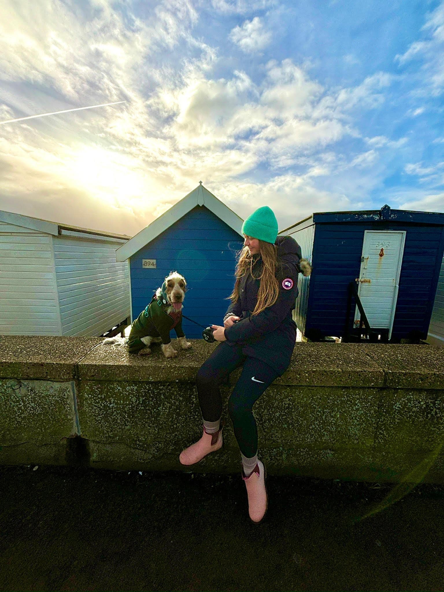 "Expert Sports Therapists Freya, Carter, and George pictured with her dog away from work"